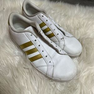 White and gold stripped adidas kids size 4.5